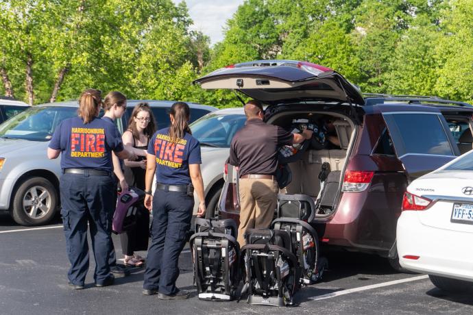 Employees checking car seat