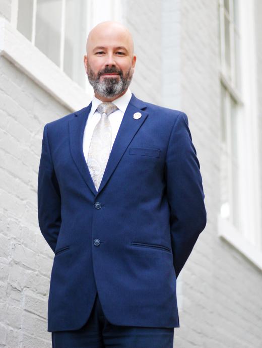 Ande Banks standing in front of brick building