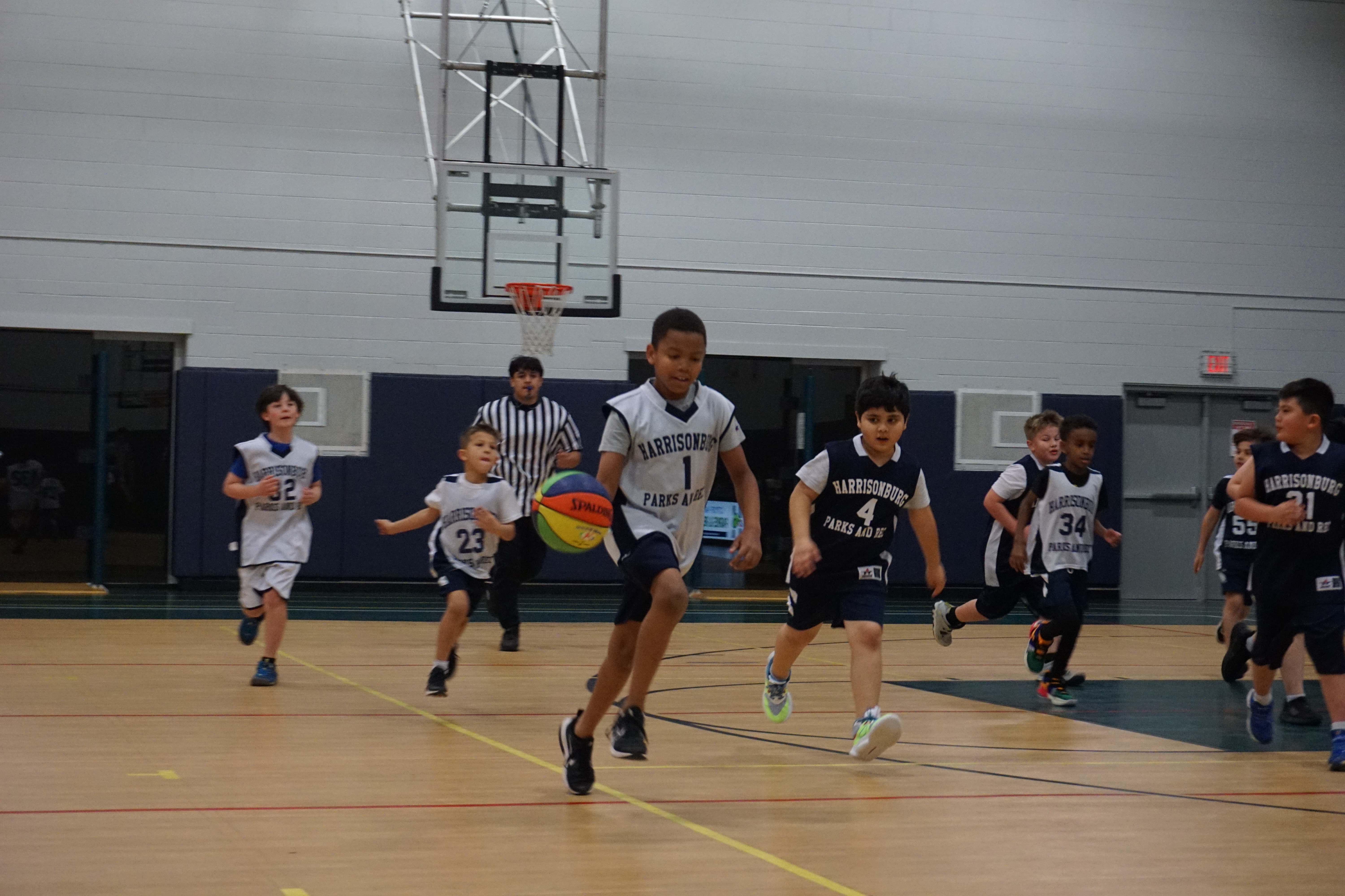 Boys playing basketball on a court