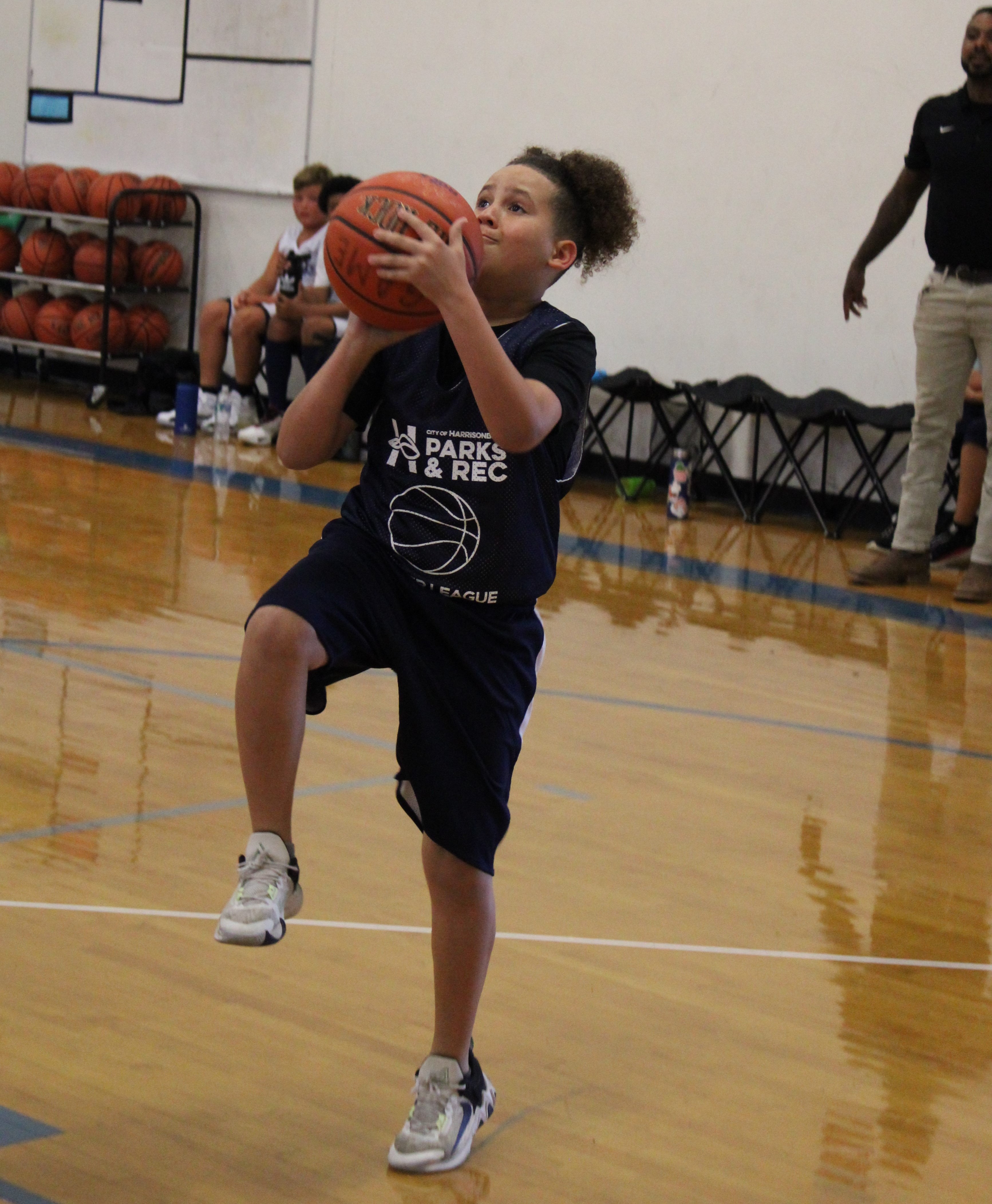 Child shooting a basketball 