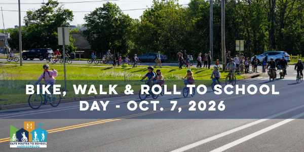 Text reads "Bike, Walk and Roll to School Day Oct 7 2026" with a large group biking.