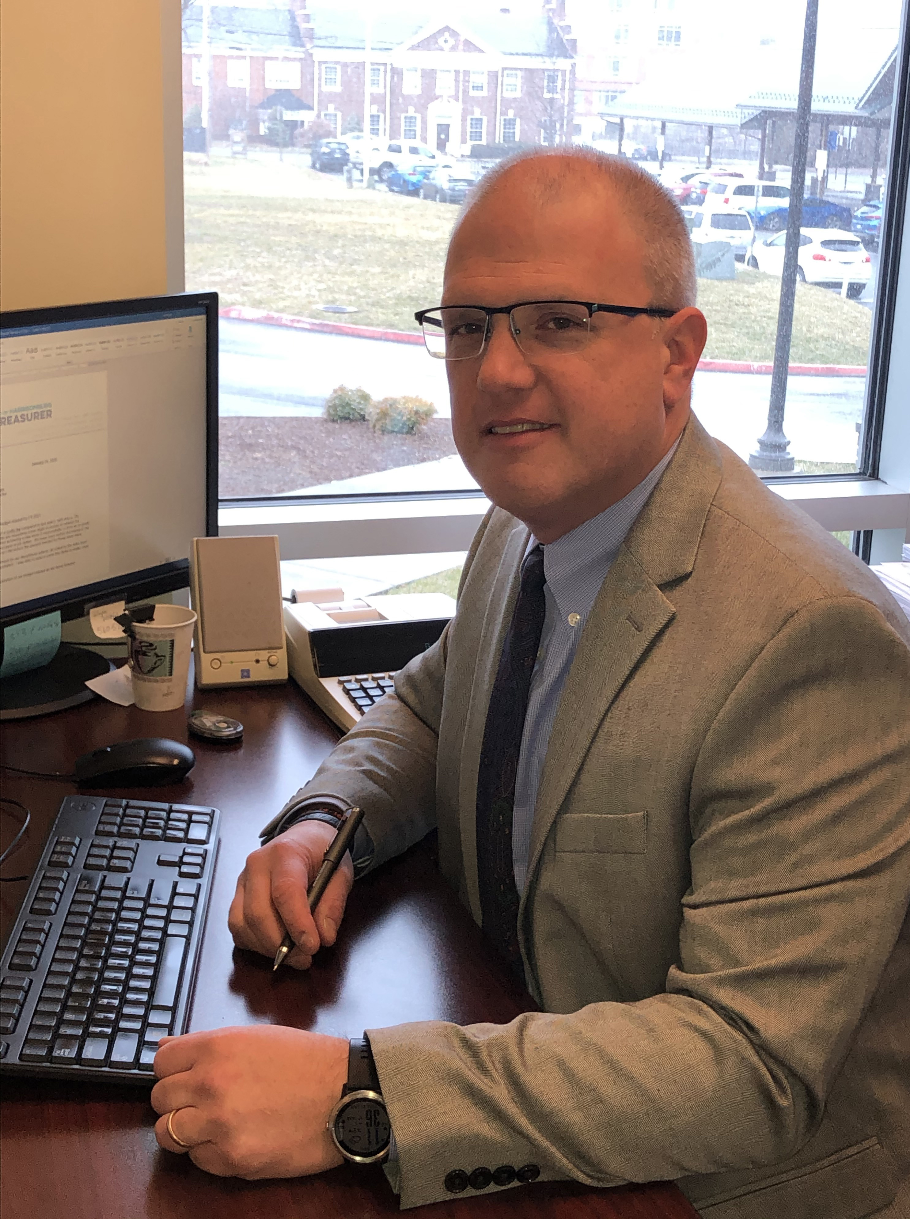 Jeff Shafer City Treasurer sitting at desk